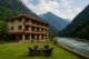 Riverside view of the best hotel in Bahrain Swat with scenic mountains in the background