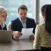 Interviewer checking the resume of a candidate