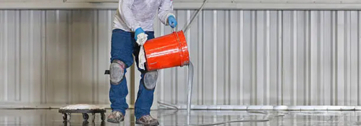 A worker coating in floor chemical resistant epoxy.