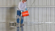 A worker coating in floor chemical resistant epoxy.